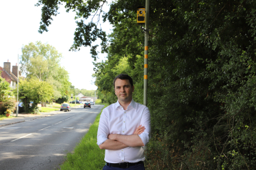 Lewis next to a speed camera